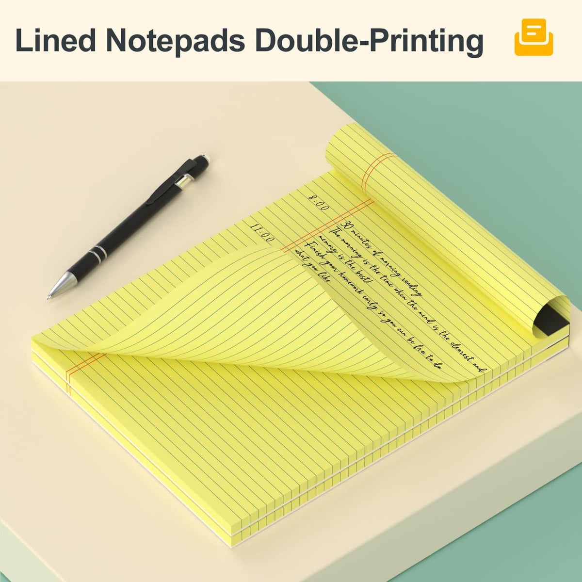 Yellow double-printed legal pad with pen, lined pages, black spine