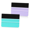 Pair of vinyl squeegees with black felt pads, turquoise and purple plastic bodies