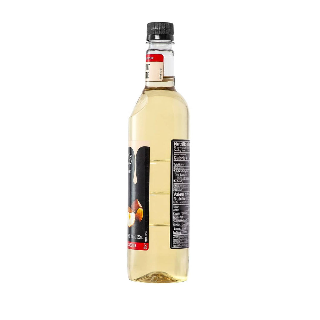 Hazelnut syrup bottle back label view with black cap and amber liquid