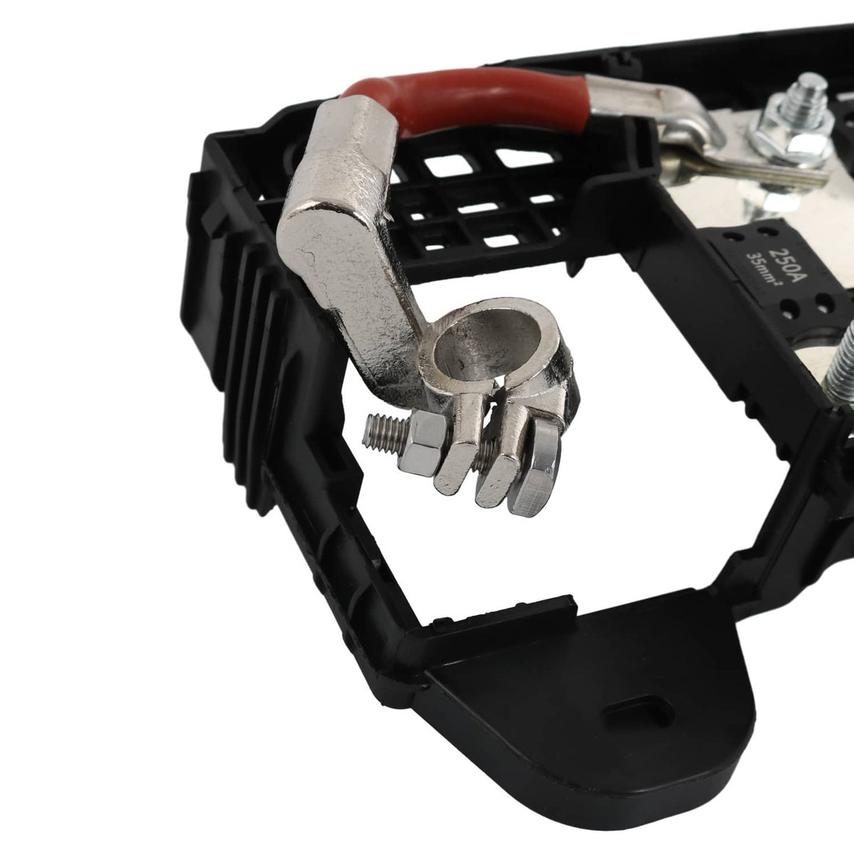 Black fuse block terminal with exposed metal clamp and red wire lead
