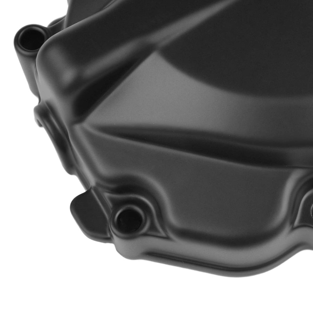 Close-up detail of black left engine stator cover crankcase edge and bolt holes