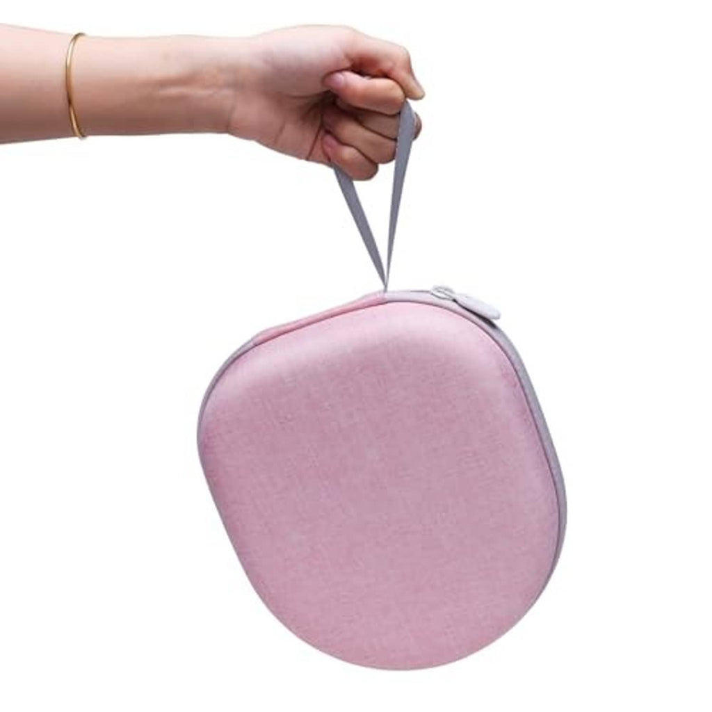 Light pink oval headphone case with zipper, held by the wrist strap.