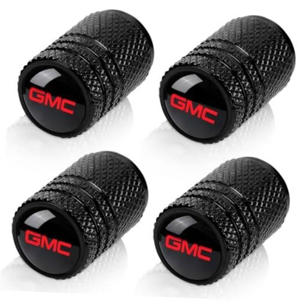 Set of four black textured tire valve stem caps with red GMC logo