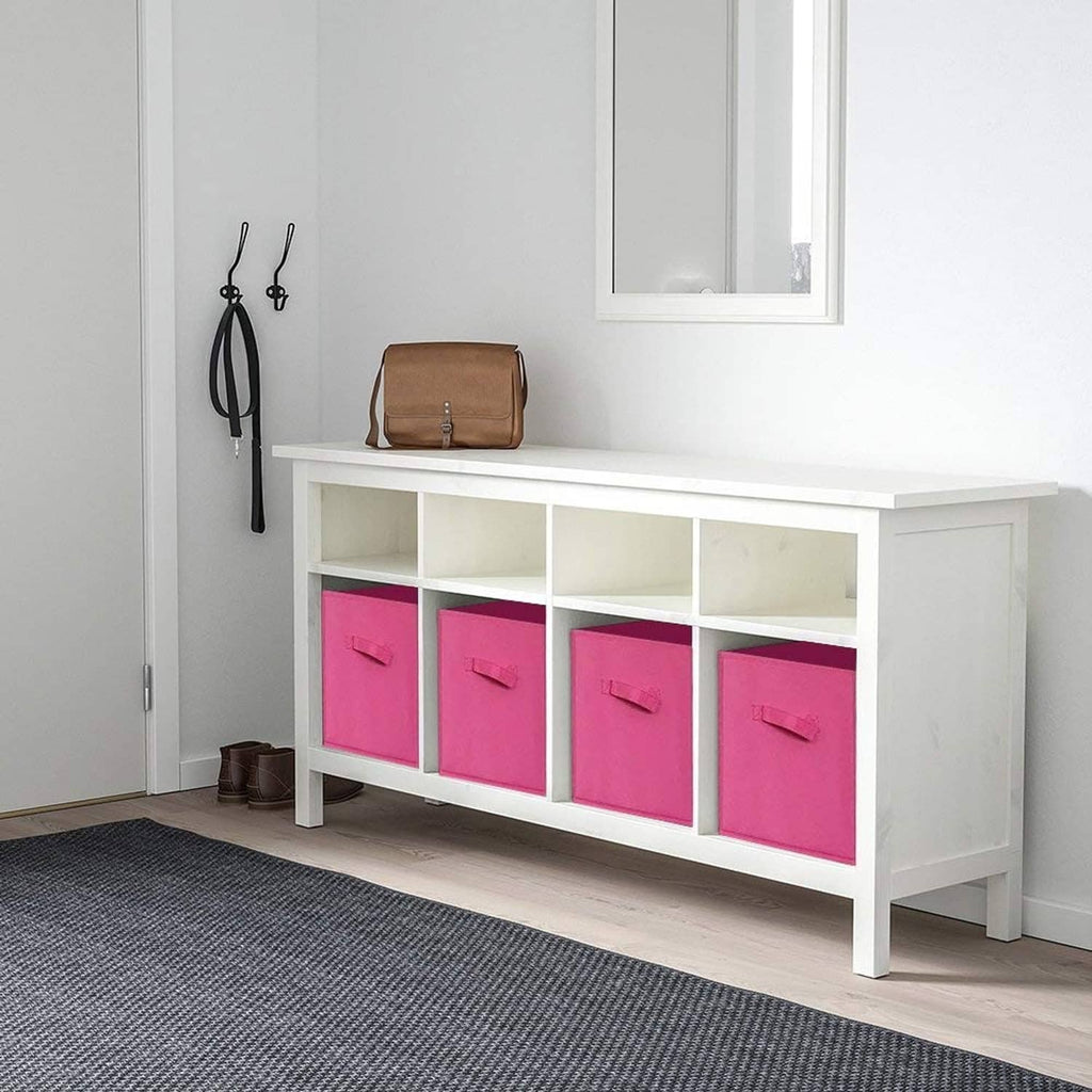 Fuchsia fabric storage cubes in a white cabinet, multiple bins with front handles