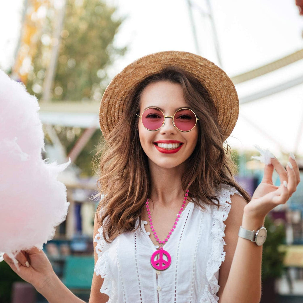 Pink peace pendant bead necklace and round pink-lens sunglasses with gold frames