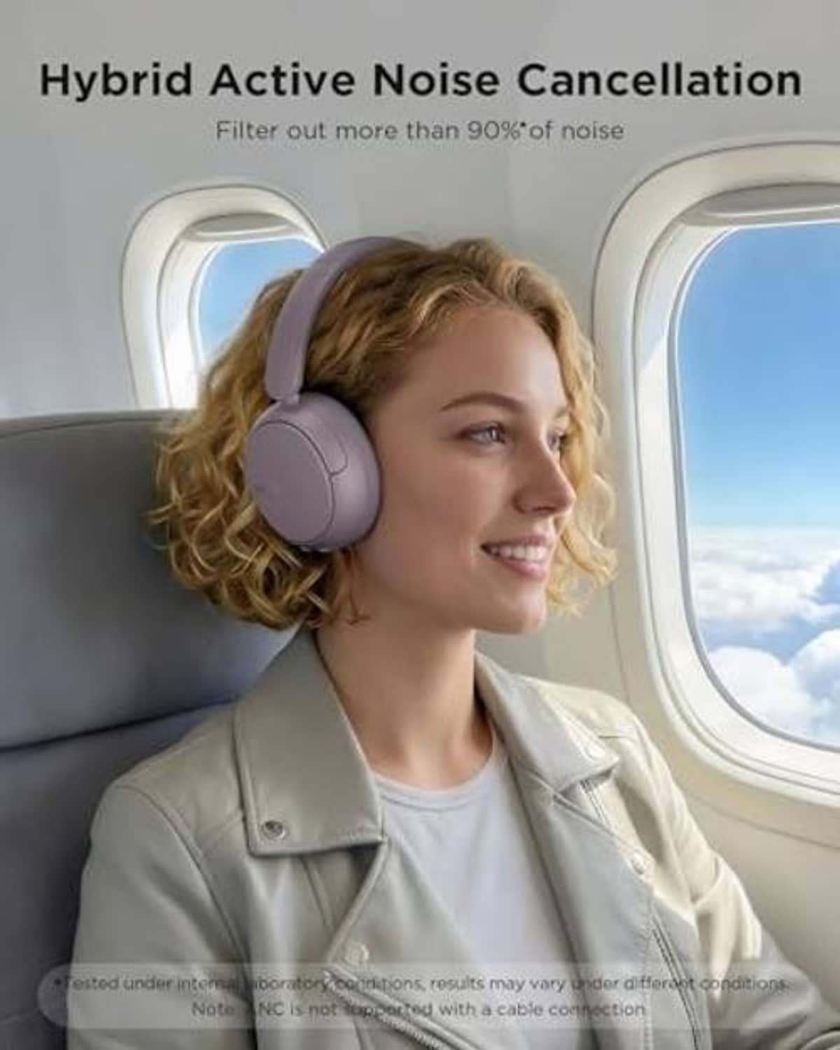 Purple hybrid ANC headphones on a user, over-ear design with padded earcups