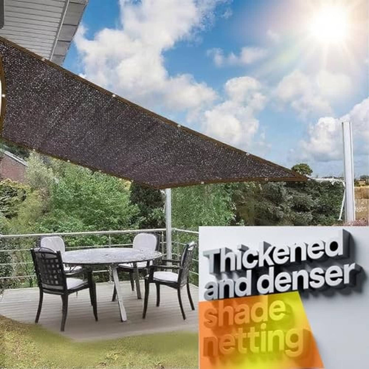 Black shade cloth sail stretched overhead over patio seating and table