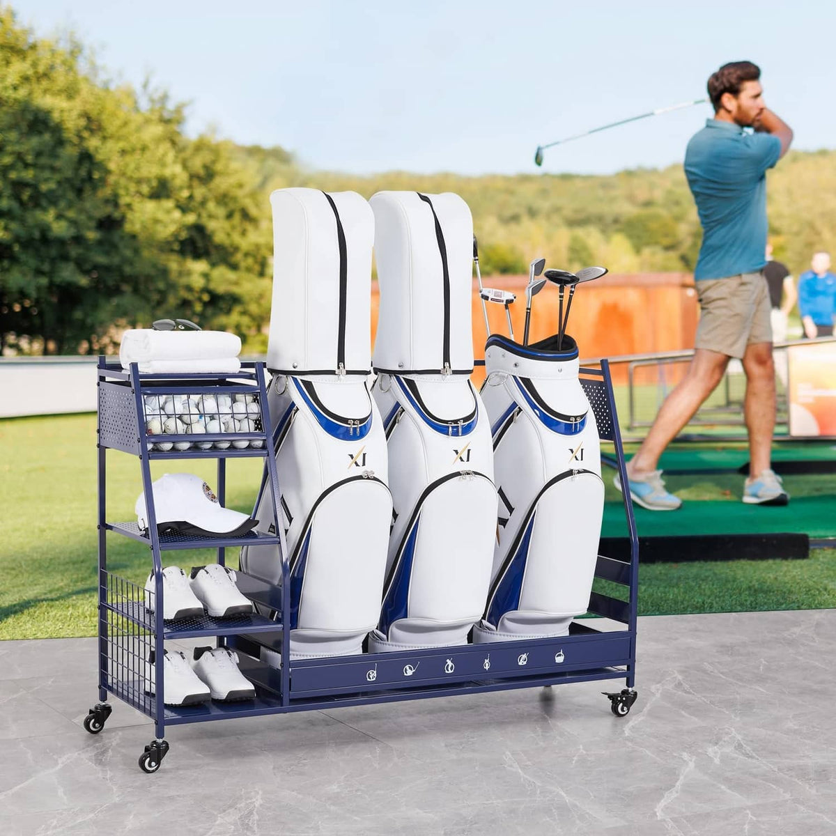 Blue golf bag organizer rack with three white covers and side shelves on wheels