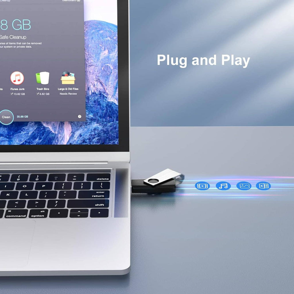 Silver and black USB flash drive plugged into a laptop USB port