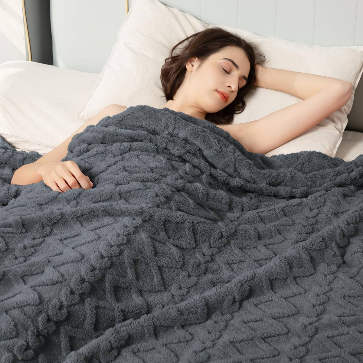Gray fuzzy blanket with chunky raised cable and geometric texture