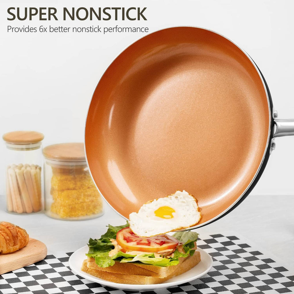 Orange nonstick 8 inch frying pan with shallow rim, stainless handle, shown cooking