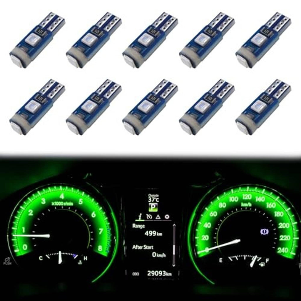 Green-lit car instrument cluster gauges with T5 LED bulbs, needles and displays visible.