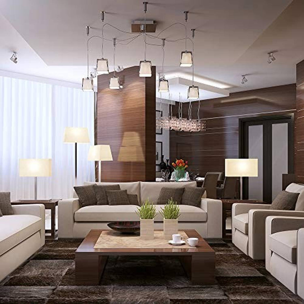 A21 LED light bulbs installed in a ceiling track fixture with multiple lamps