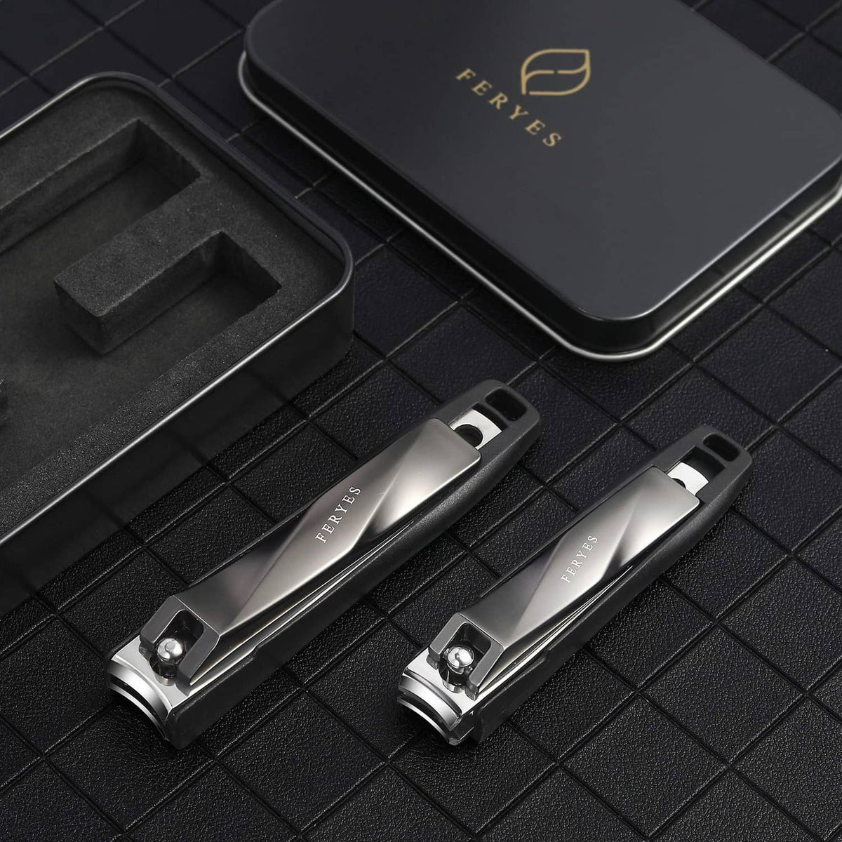 Black nail clipper set of two with silver cutting blades and lever handles