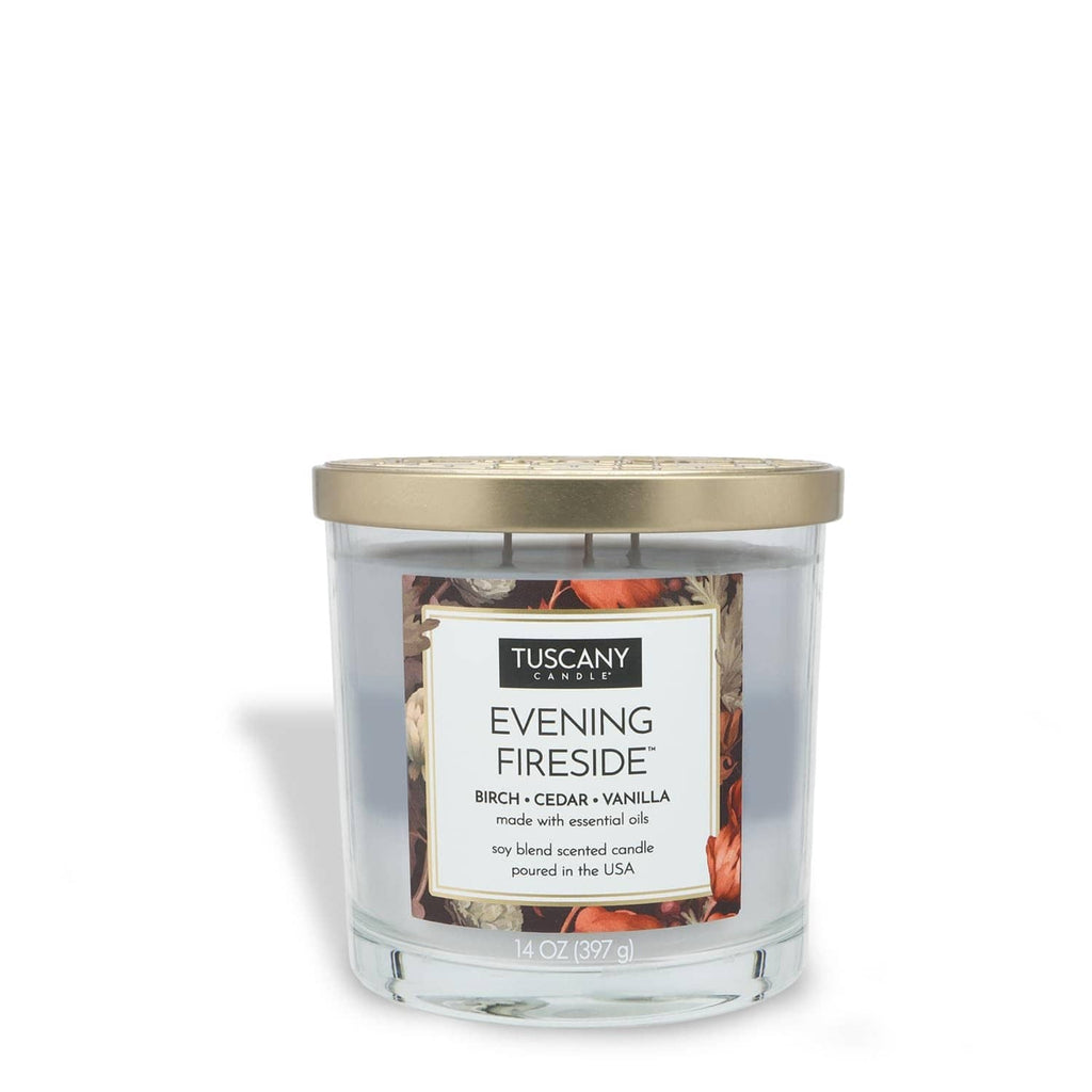 Blue glass jar candle with gold lid and Evening Fireside scent label