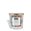Blue glass jar candle with gold lid and Evening Fireside scent label