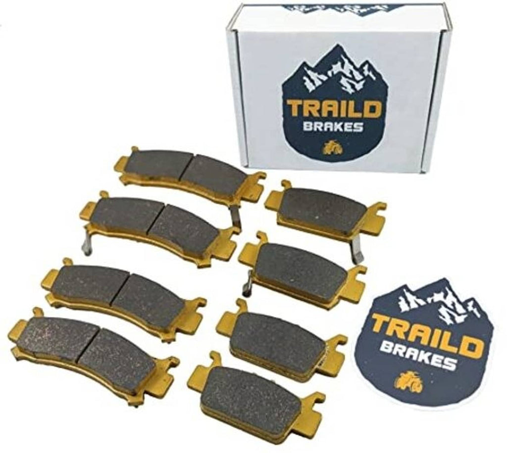 Ceramic brake pad set with multiple dark gray pads and gold backing, boxed