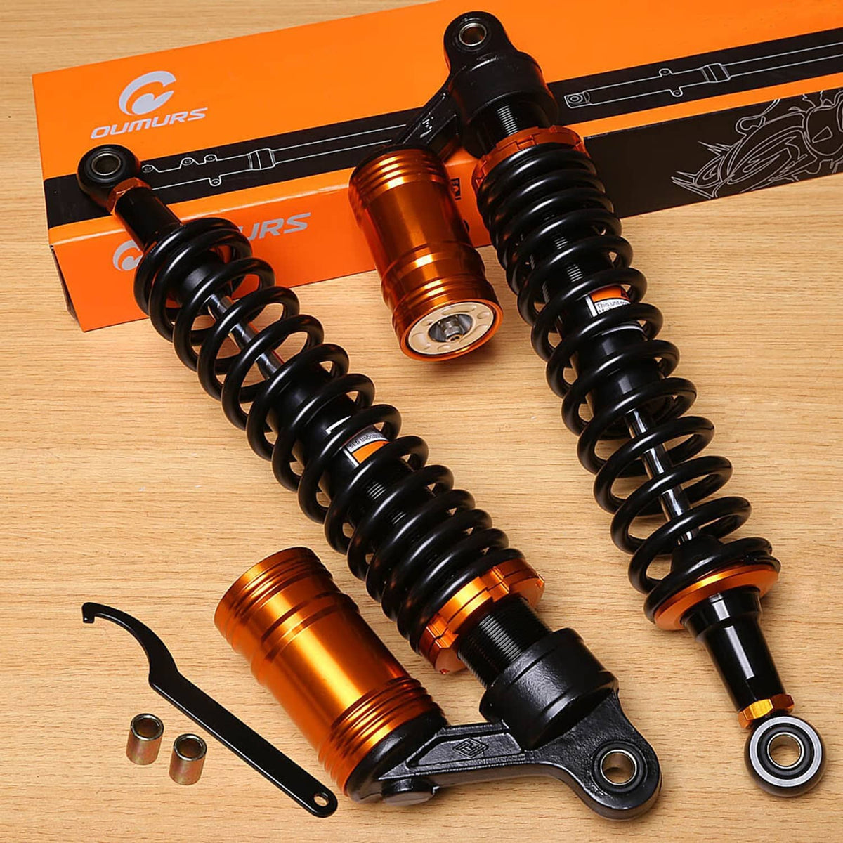 Pair of air shock absorbers with black coils and bronze cylinder bodies