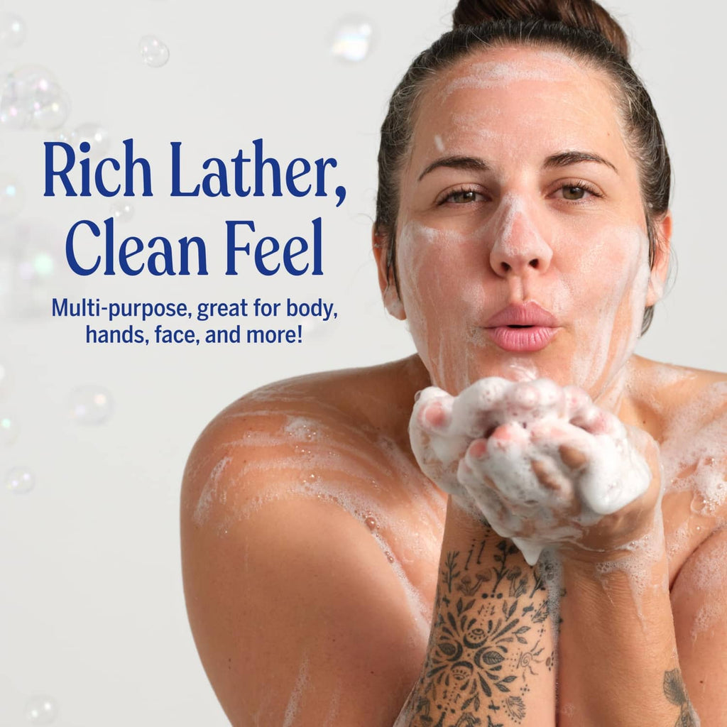 Person rinsing off rich lather from peppermint soap on skin