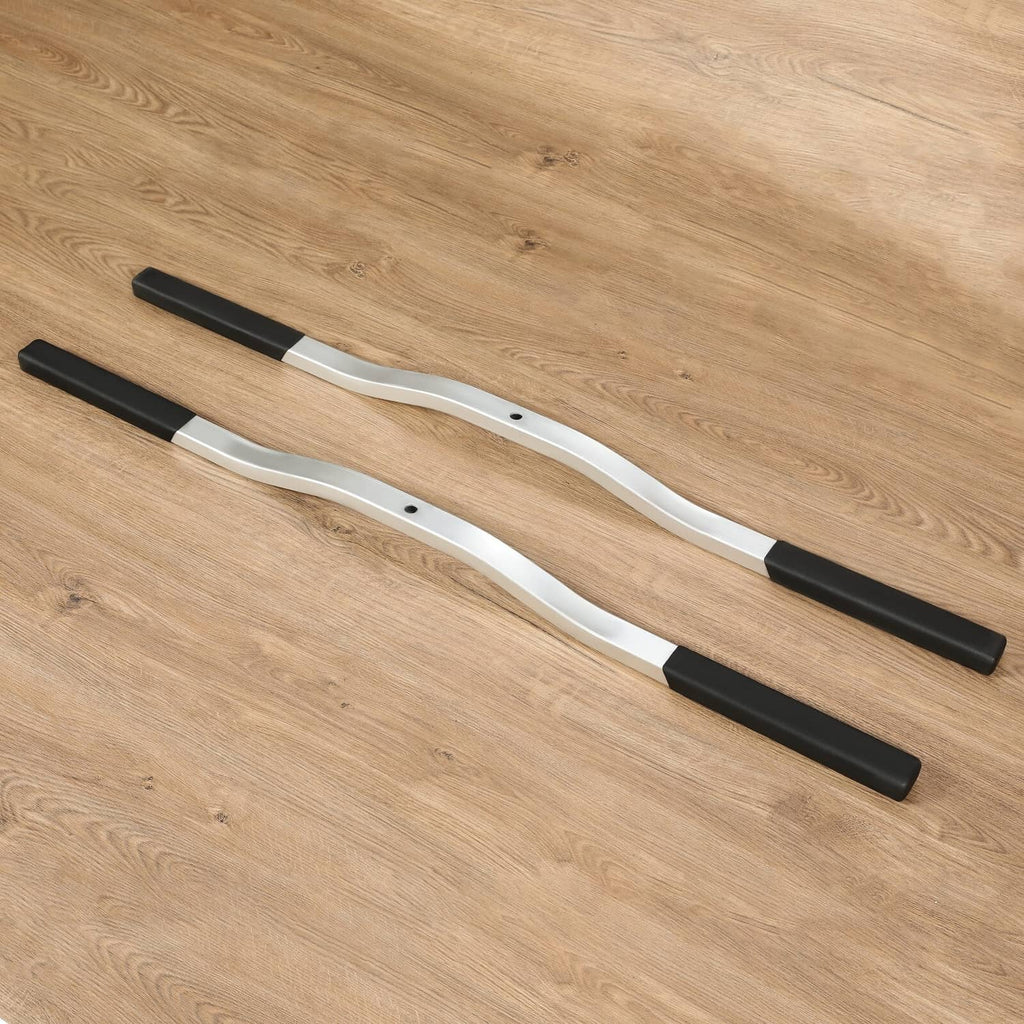 Two silver ski tie-down bars with black boots, spaced parallel on a flat surface