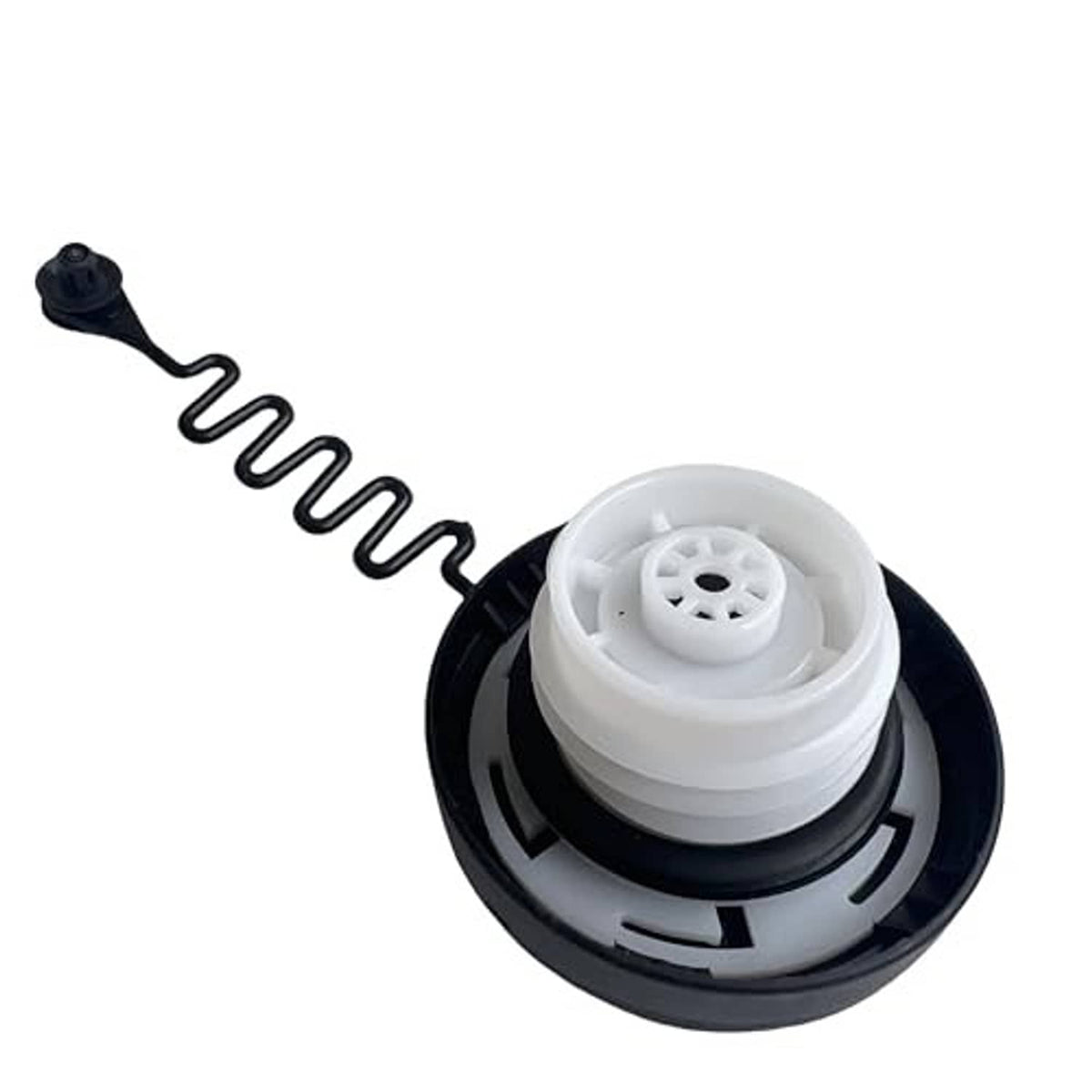 Fuel tank filler cap underside, dark outer housing with light center insert and spring