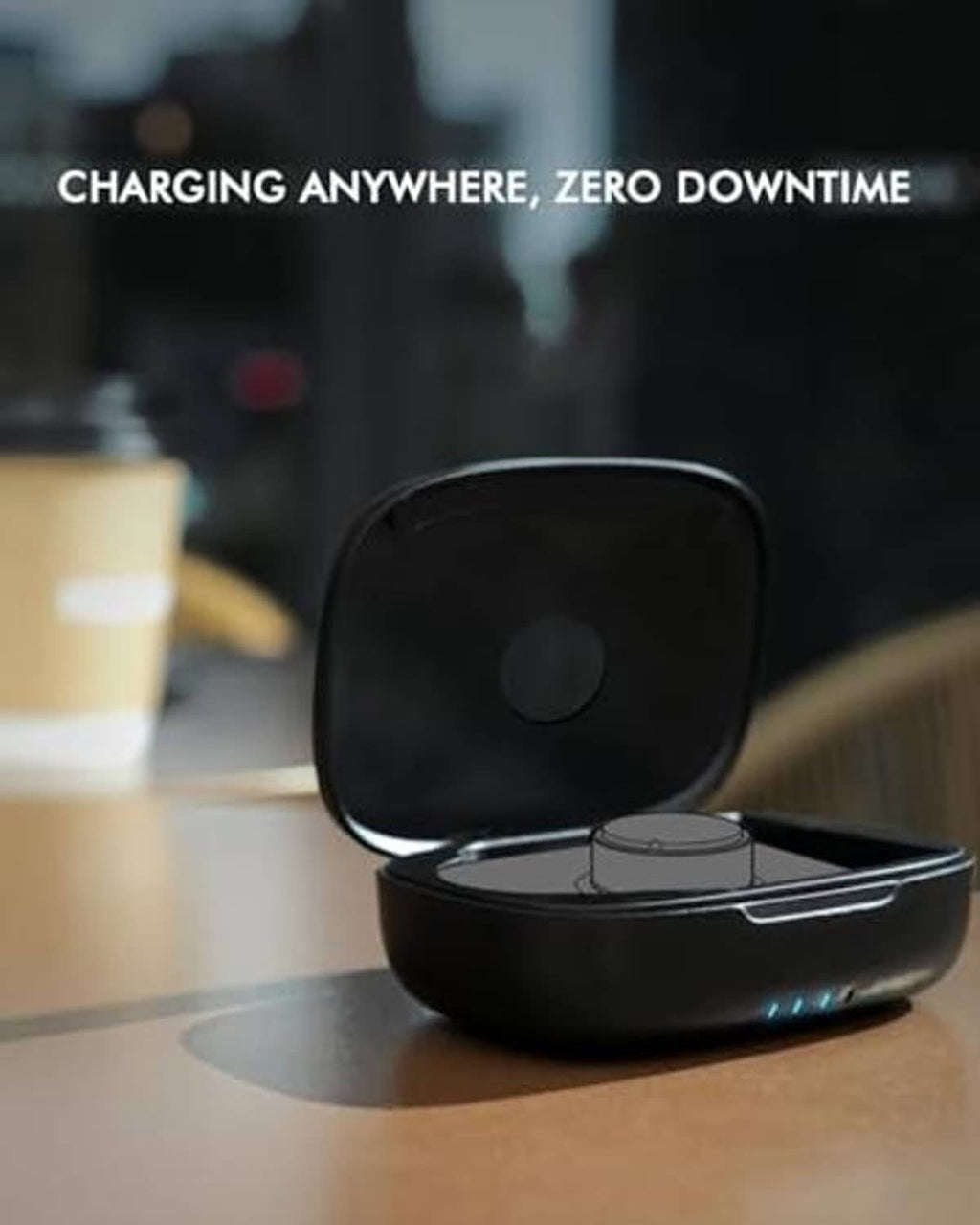 Black charging case on tabletop with lid open, showing the charging cradle