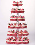 6-tier acrylic cupcake stand with red frosted cupcakes and green-pink toppers