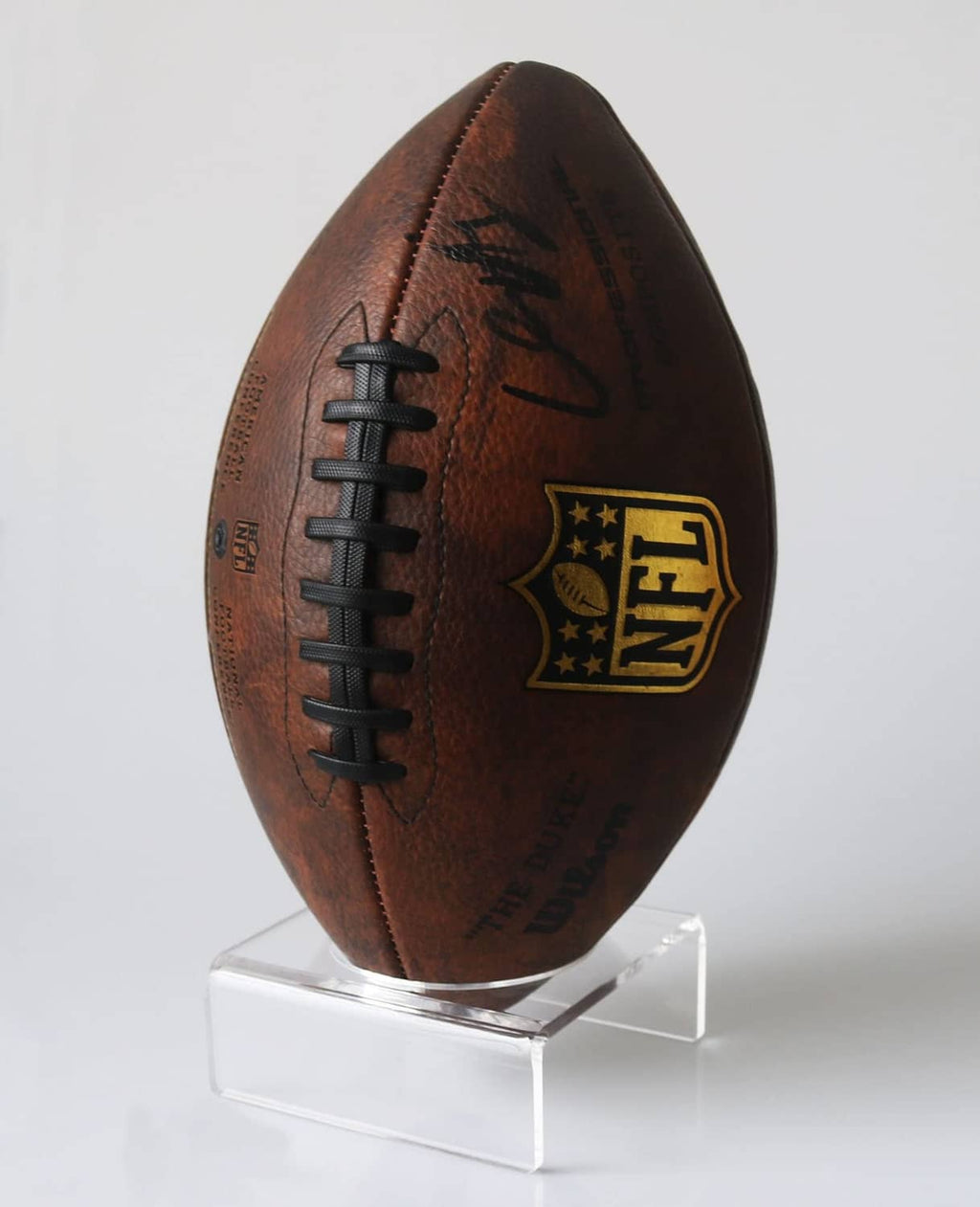 Clear acrylic football display stand with rectangular base and upright holder