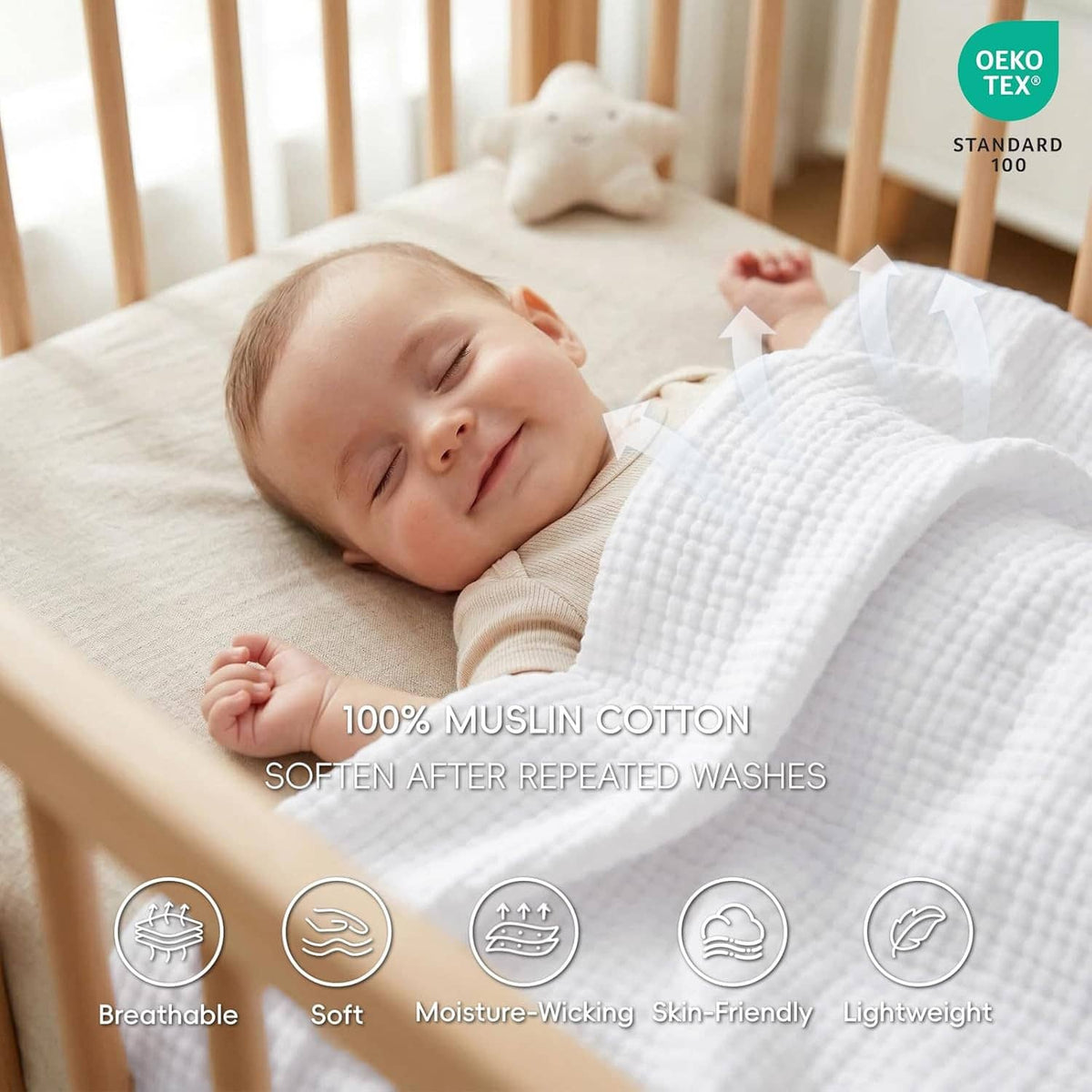 White muslin cotton blanket covering a baby on a crib mattress