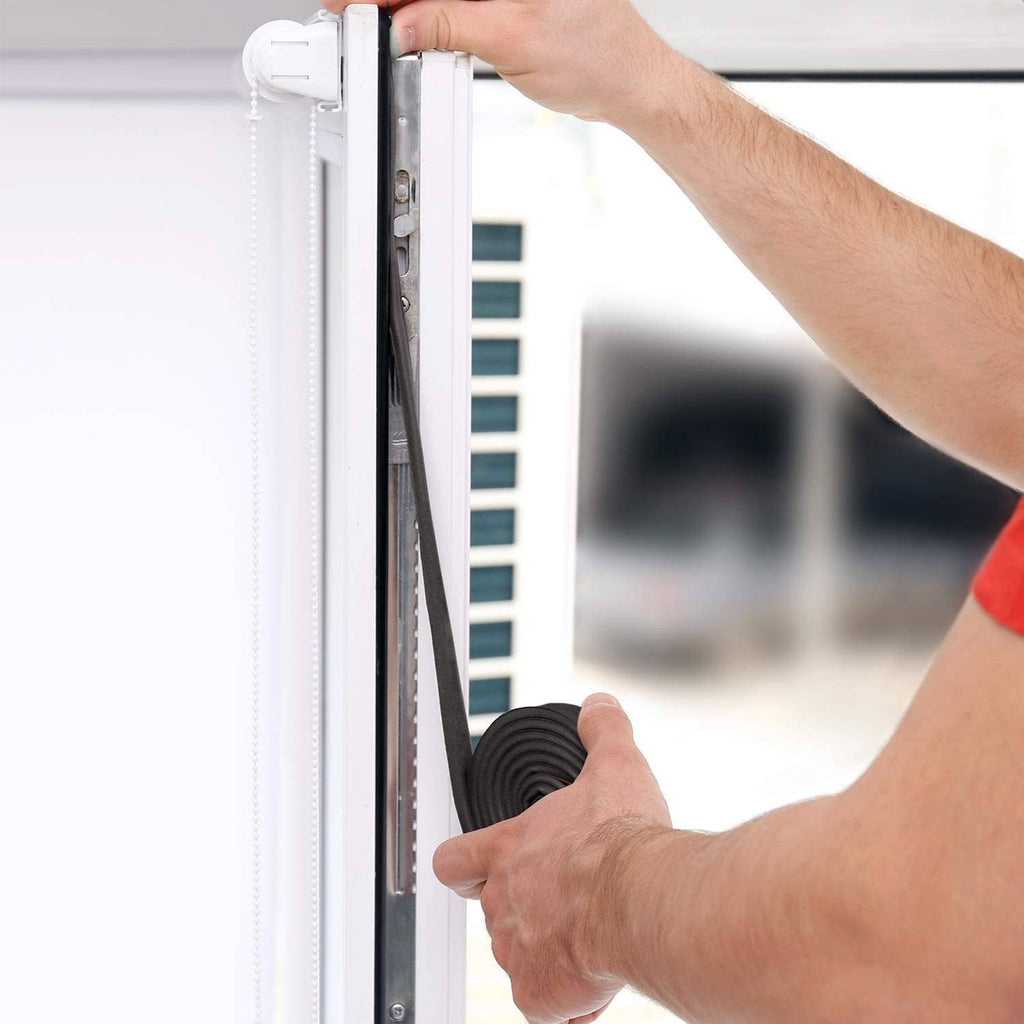 Black foam strip being installed around a window frame edge