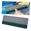 Gray vinyl wrap squeegee tool with built-in ruler and dark felt edge