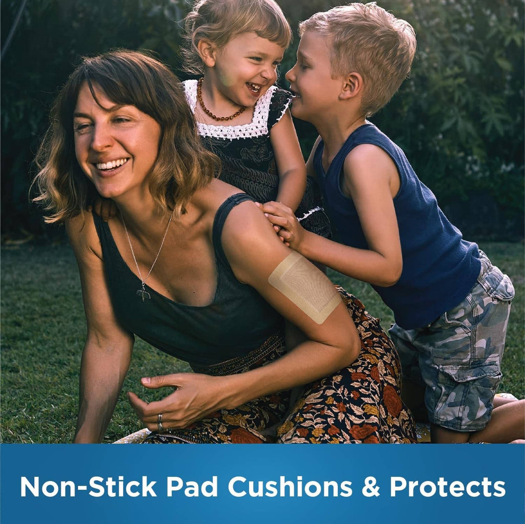 Sheer adhesive bandage pad on a child's arm, cushioned non-stick pad