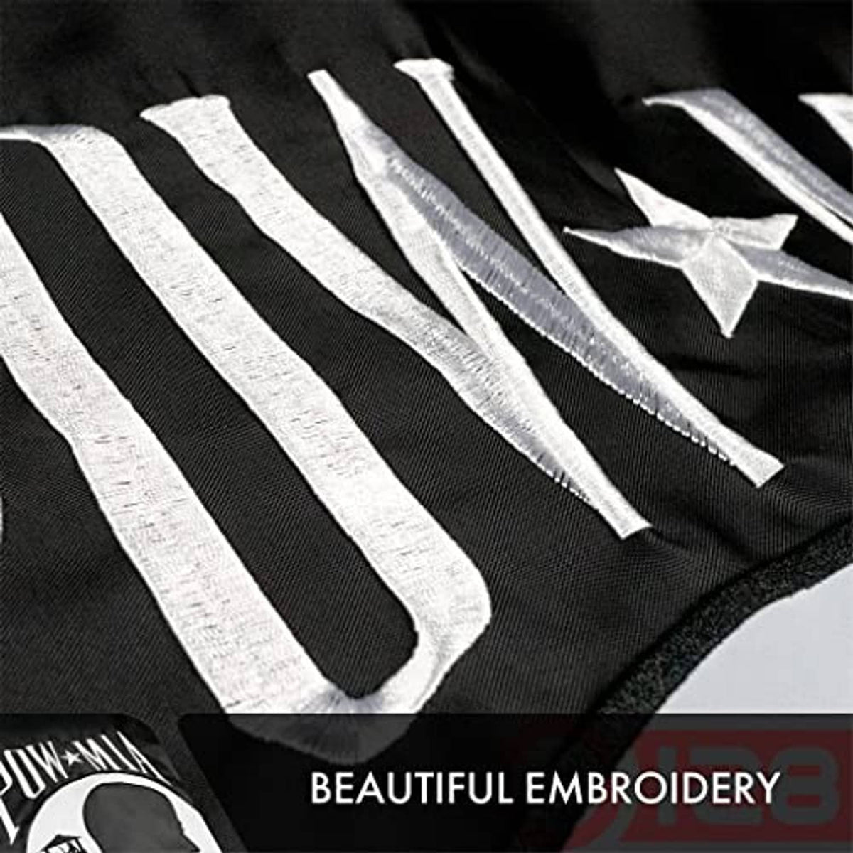 POW-MIA flag with close-up embroidery of POW text, stripes, and white star