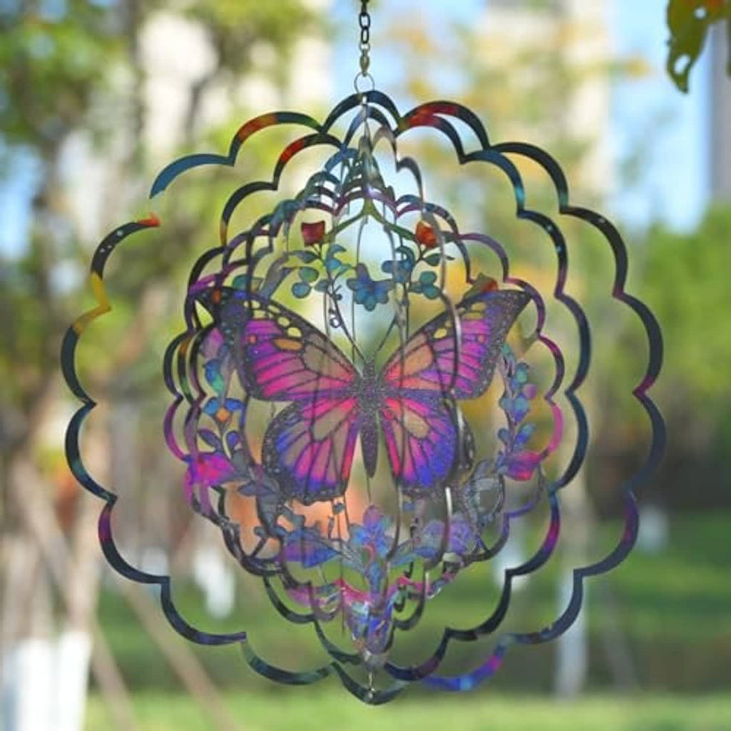 Butterfly wind spinner close-up with purple butterfly wings and layered teal-pink rings