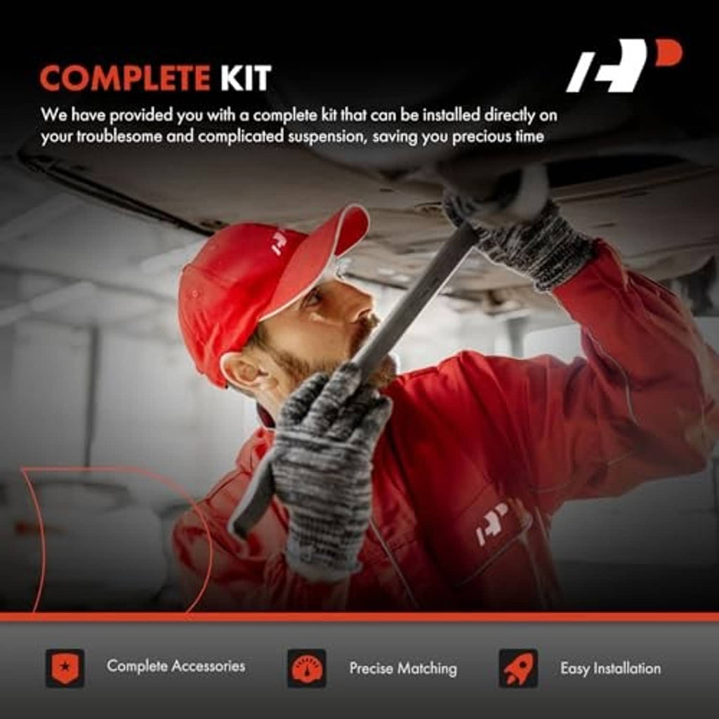 Mechanic installing a complete suspension kit under a vehicle with red gloves and tool