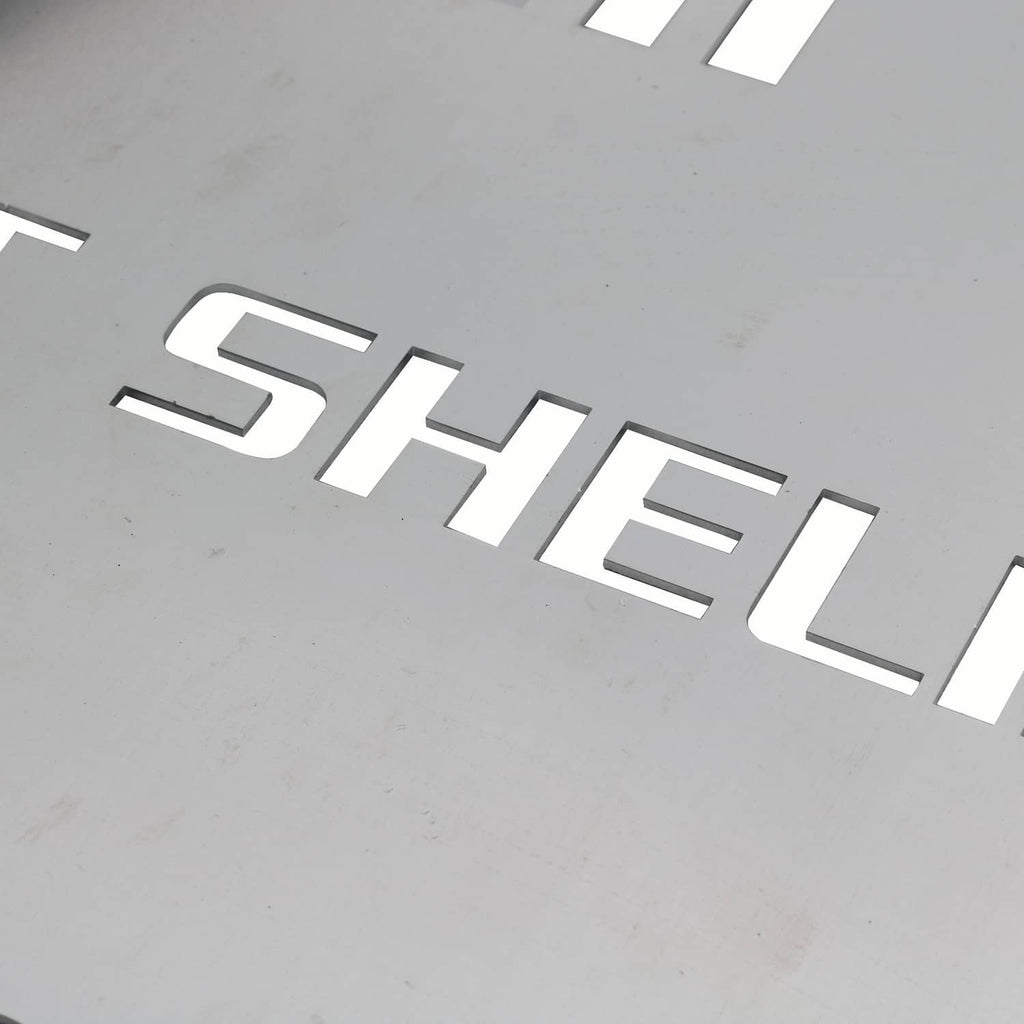Close-up of stamped CAT SHELLI lettering on a metal catalytic converter shield