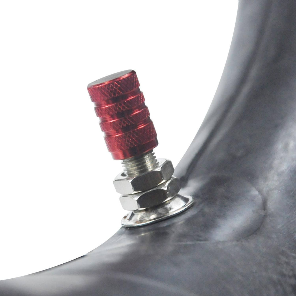 Inner tube valve stem with red valve cap and metal core on rubber