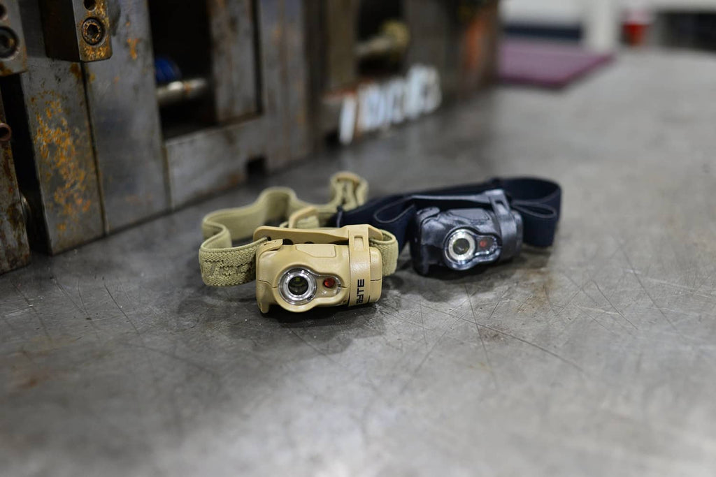 Princeton Tec Byte headlamp with tan and black units, shown with straps