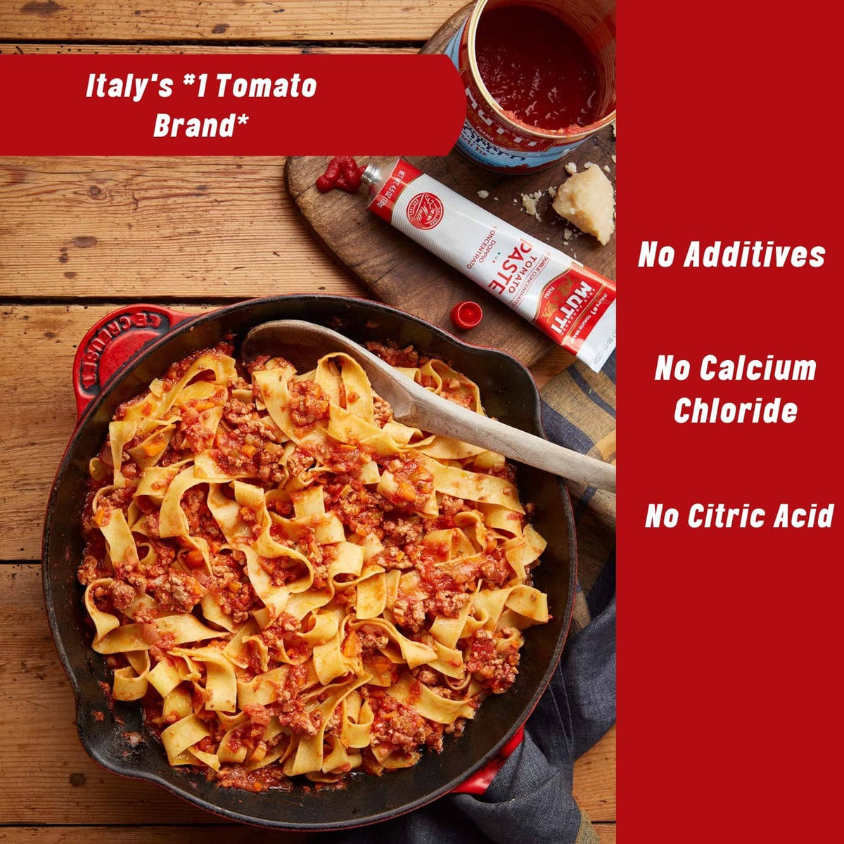 Skillet of chunky tomato sauce with Mutti tomato paste tubes