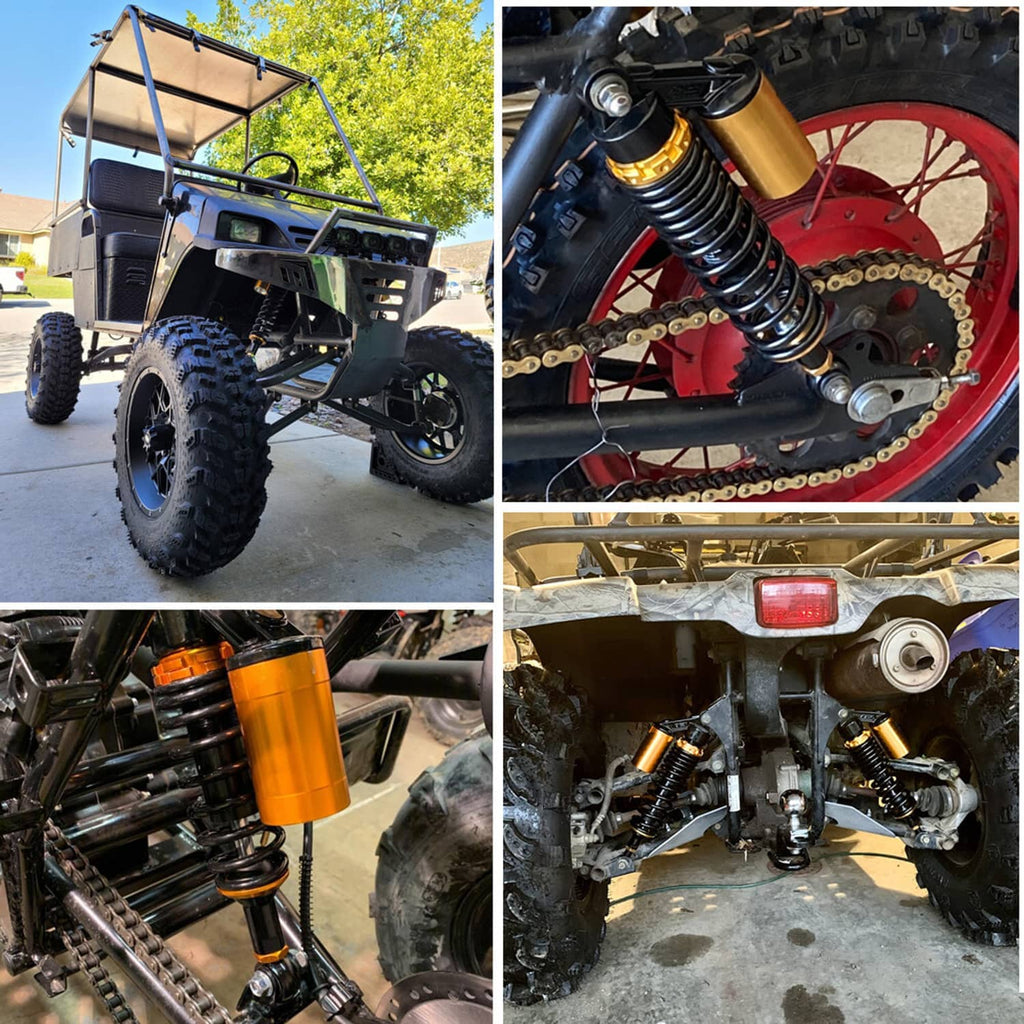 Front air shock absorbers installed on off-road ATV, showing black springs and orange caps