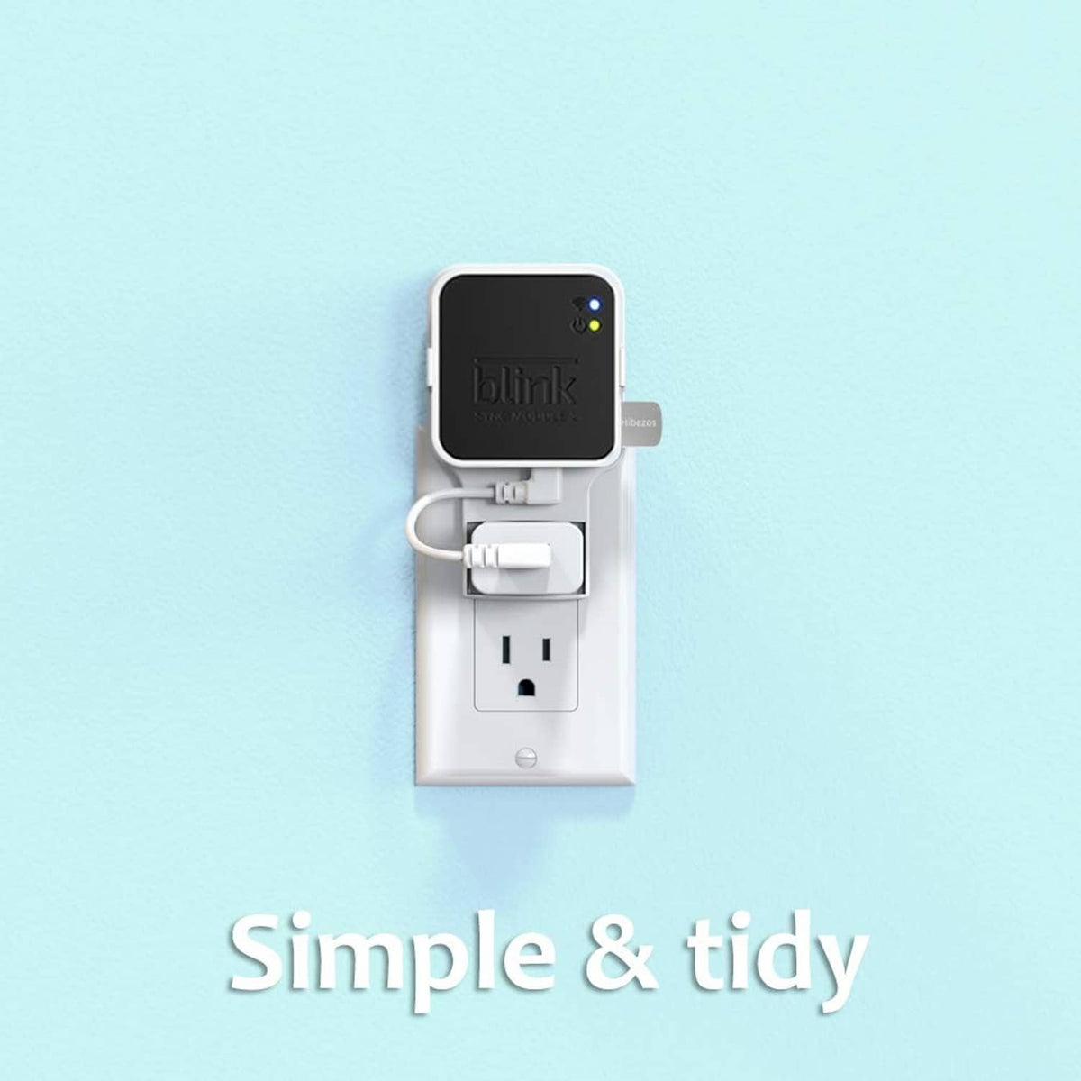 White outlet mount holding Blink Sync Module 2 unit with attached USB thumb drive