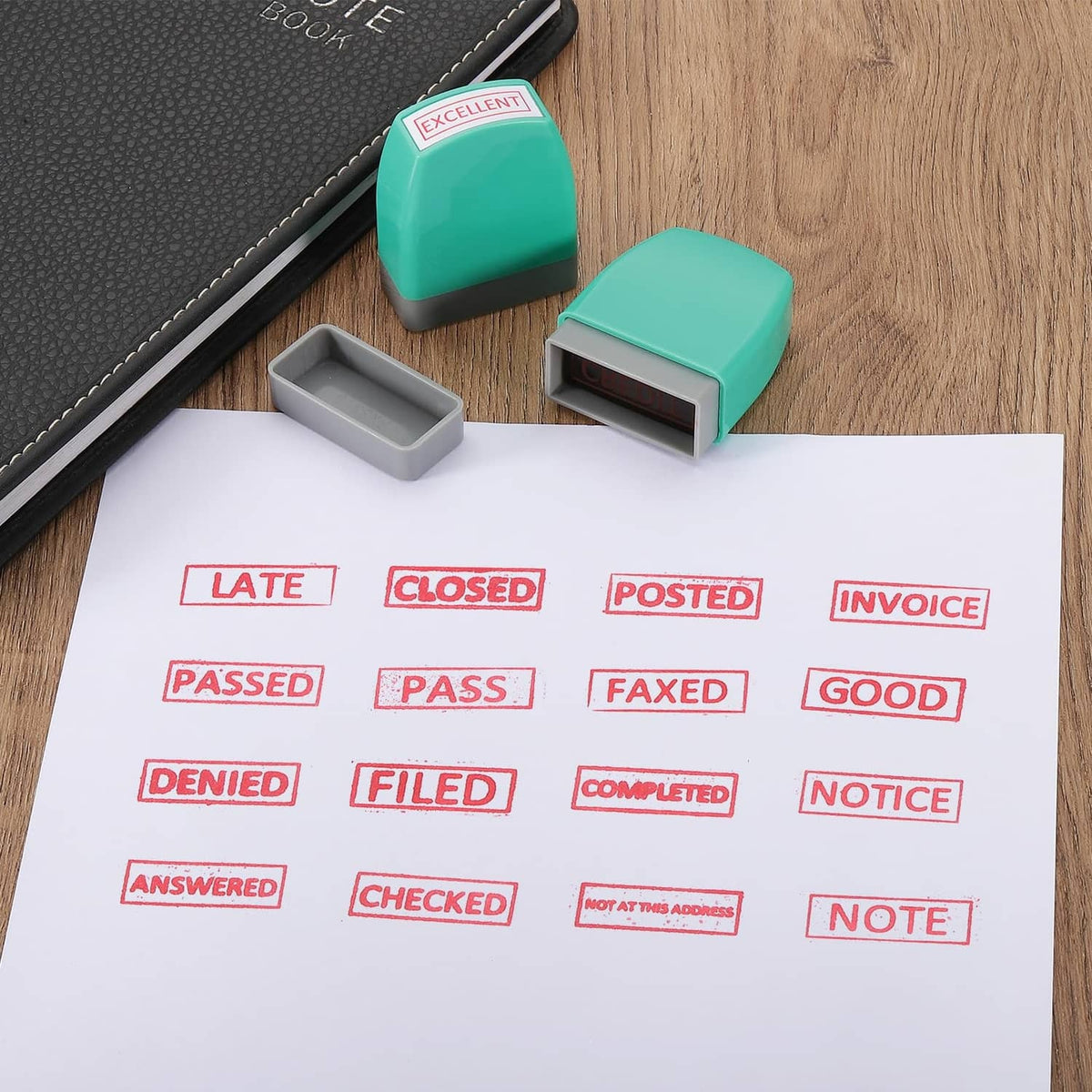 Green cash stamp next to gray ink pad and paper with multiple red stamp marks