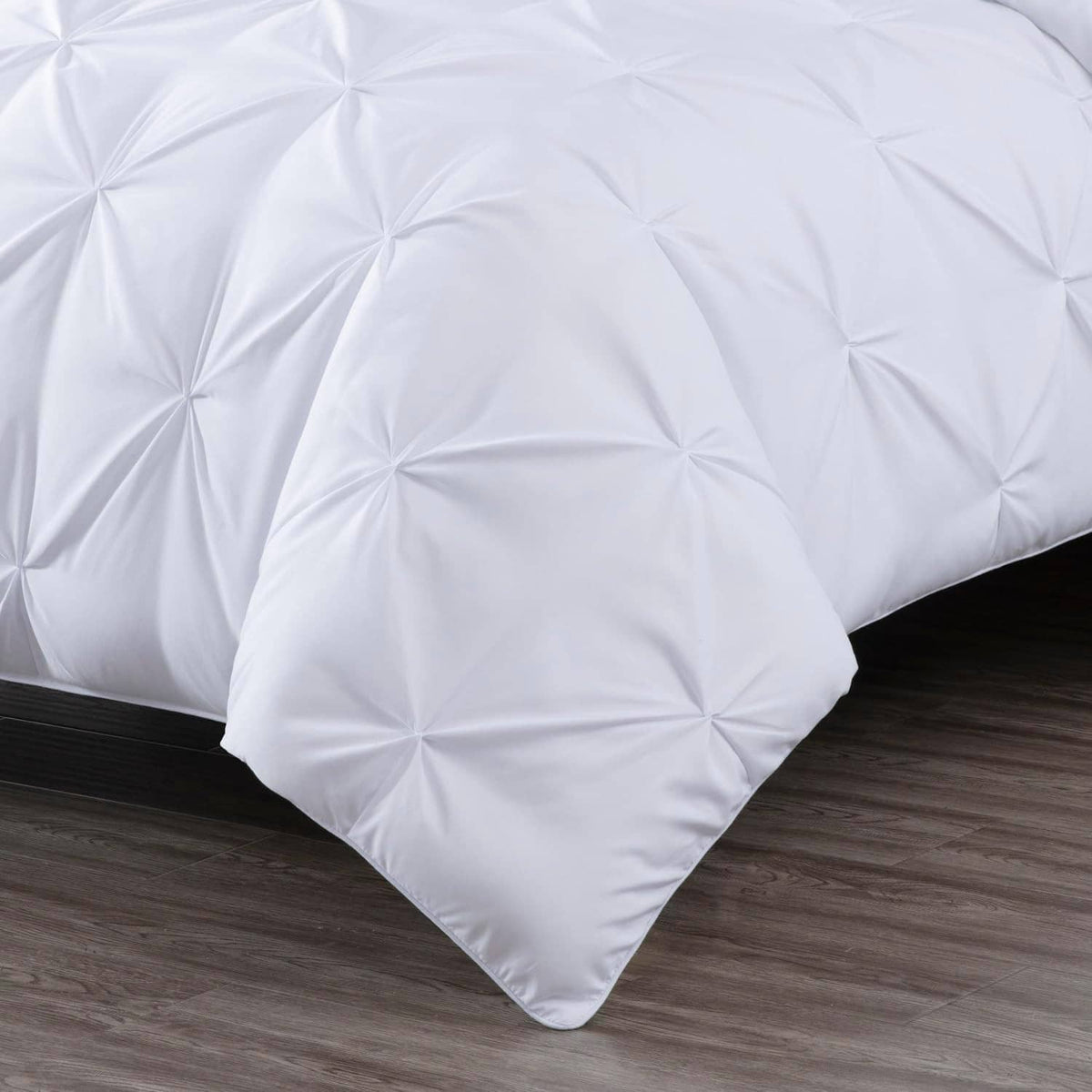 White king comforter with textured diamond pinch pleat stitching on the fabric