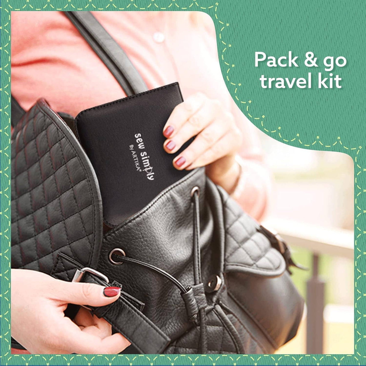 Black travel sewing kit case clipped onto a jacket with small tools inside