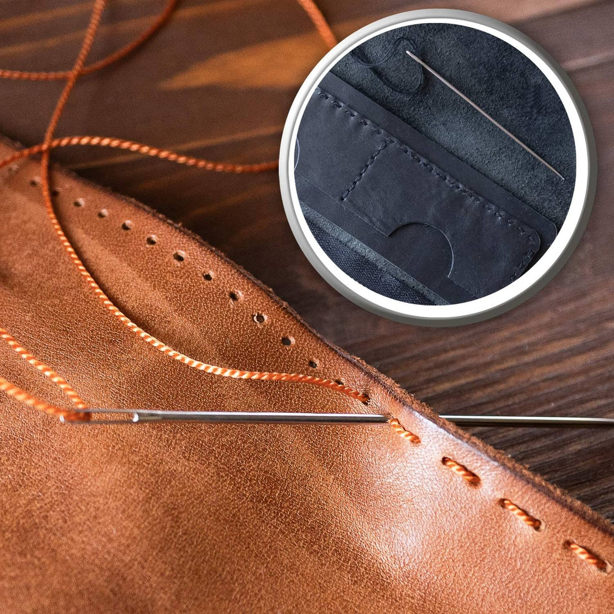 Leather hand-stitching with curved needle and orange thread along the seam
