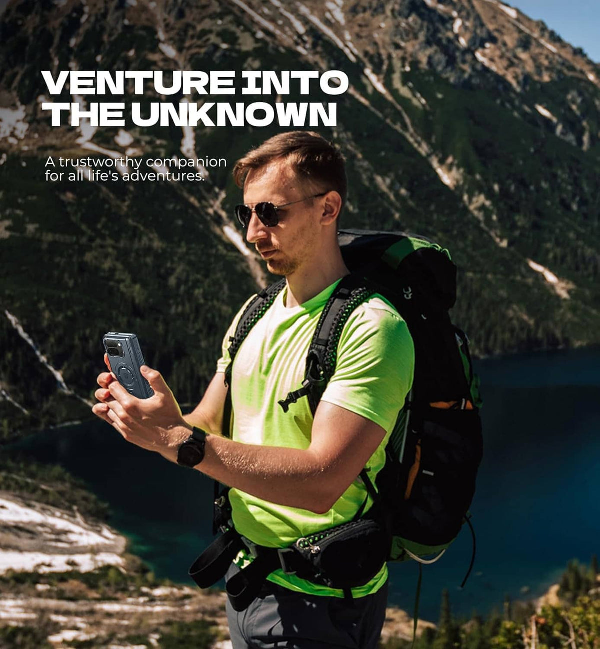 Rugged fold phone in magnetic case held outdoors by a hiker, phone close-up