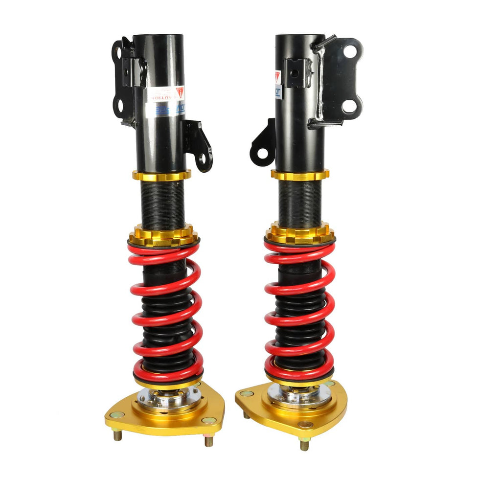 Coilover shocks upright with red springs and gold top bases