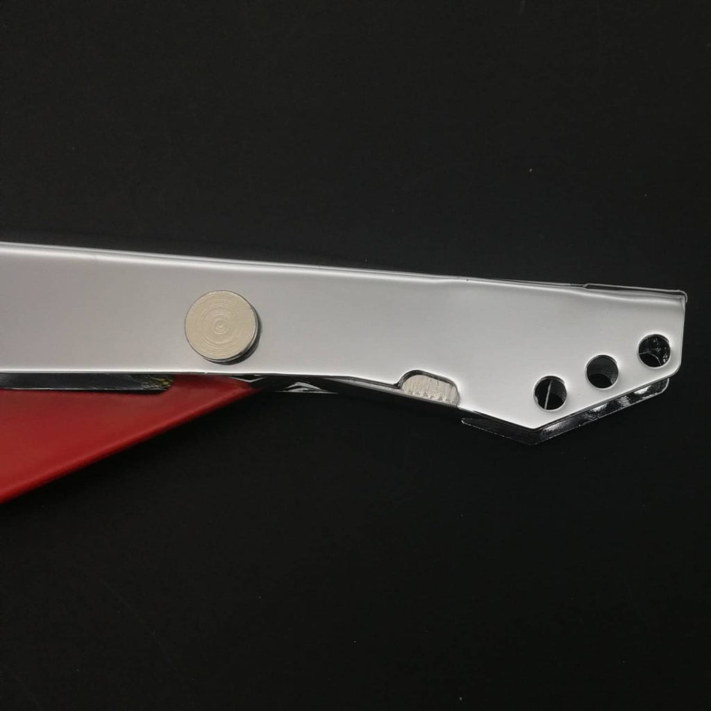 Close-up of silver striker tool tip with round cap and side holes