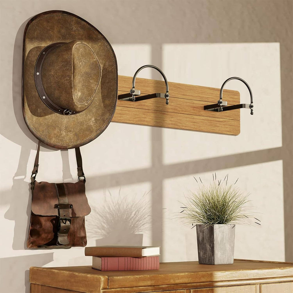 Two wall-mounted hat racks with arched hooks holding cowboy hats