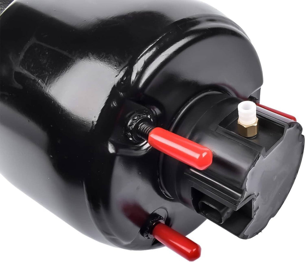 Close-up of air suspension strut top housing with black connector and red push pins